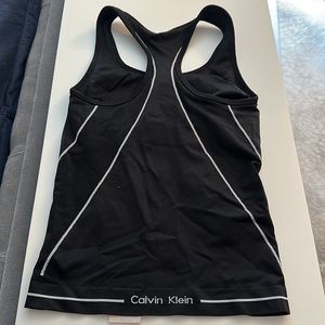 Calvin Klein black compression top with built in sports bra, lightly used, sz sm